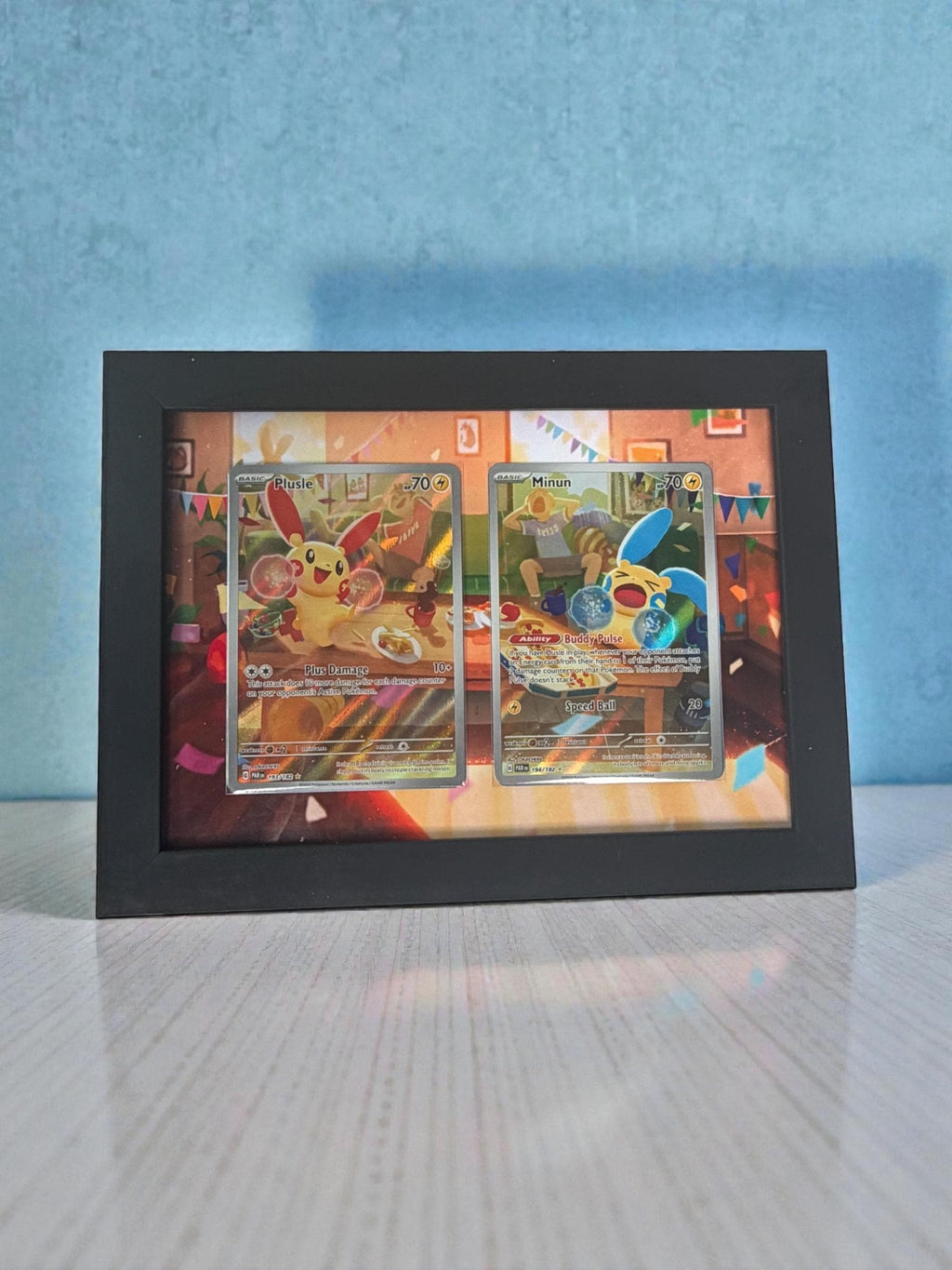 Plusle and Minun from Paradox Rift Extended Pokémon Frame
